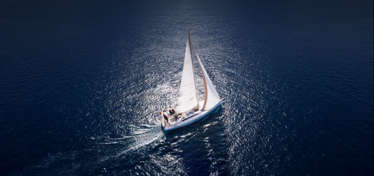 Boat Sailing On Blue Water