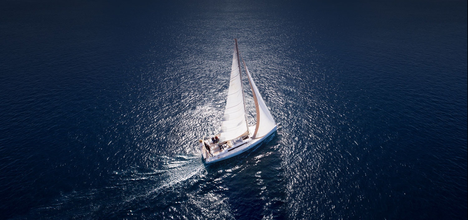 Boat Sailing On Blue Water